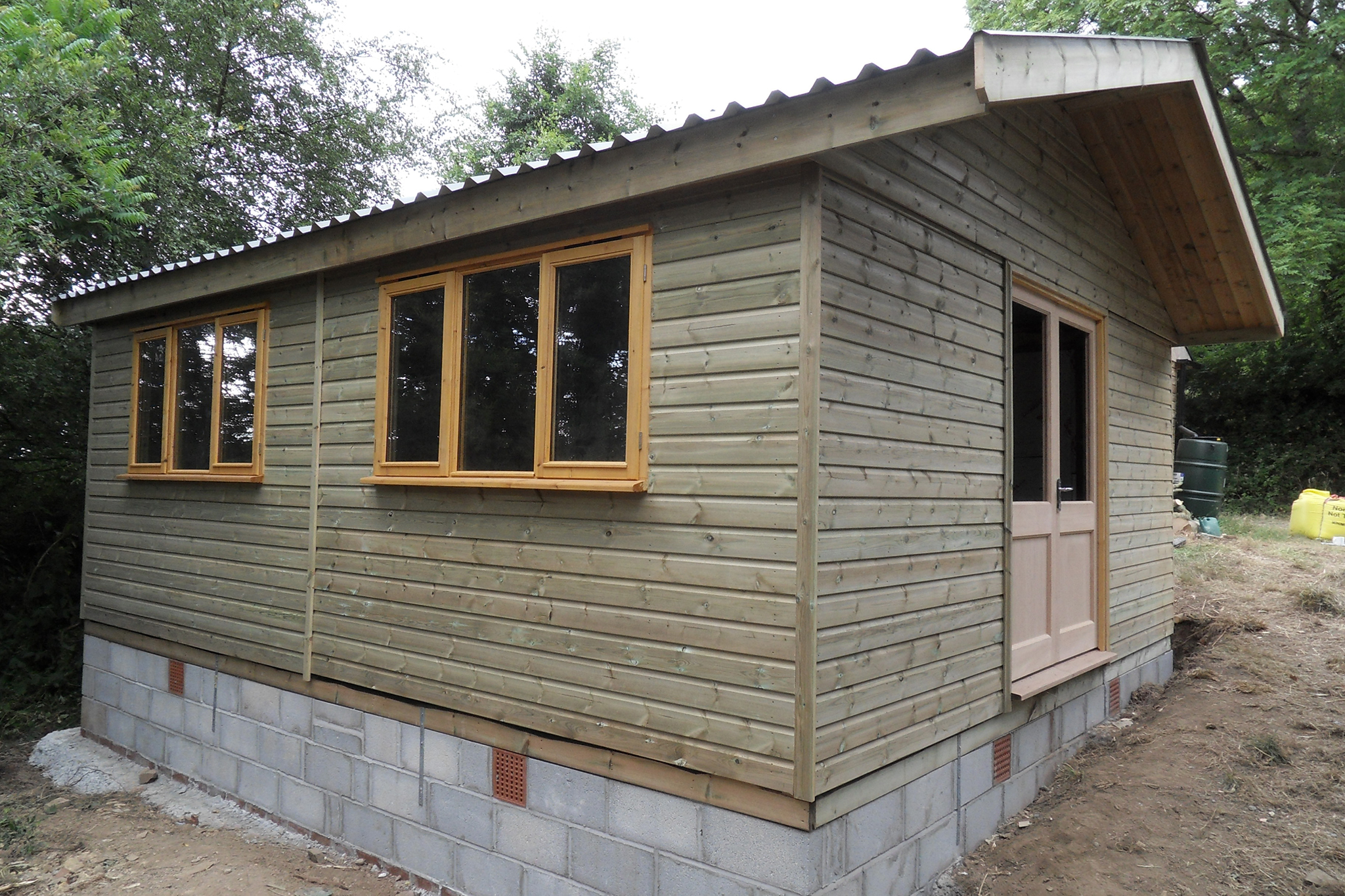  A studio one bedroomed Shiplap chalet, fully partition with kitchenette, shower room. The roof is a 0.7mm plastic coated box profile tin - Harris Timber Products